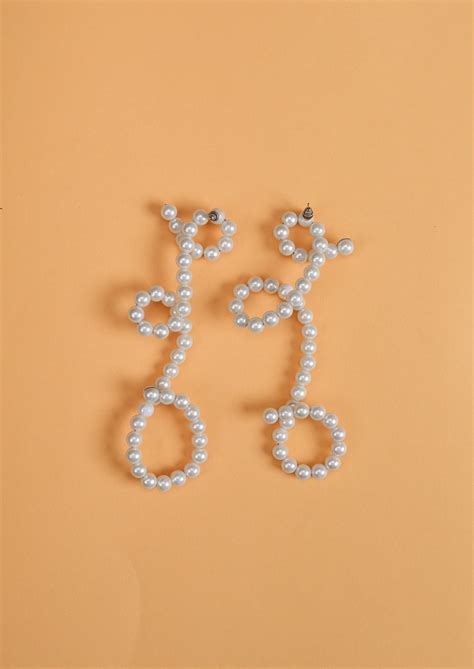 Elegant White Pearl Dangler Earrings – modarta