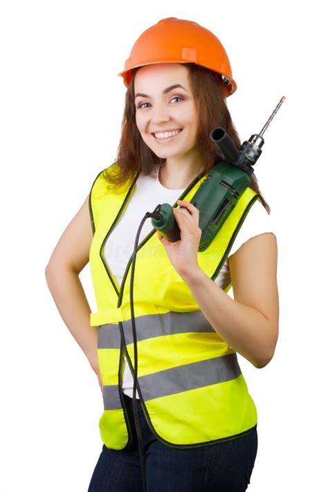 The Girl in a Construction Vest and a Helmet with an Electric Drill ...