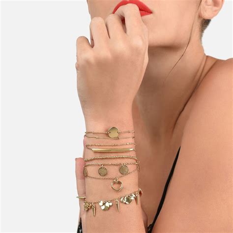 Buy Zaveri Pearls Set of 8 Gold Tone Contemporary Classy Stackable ...