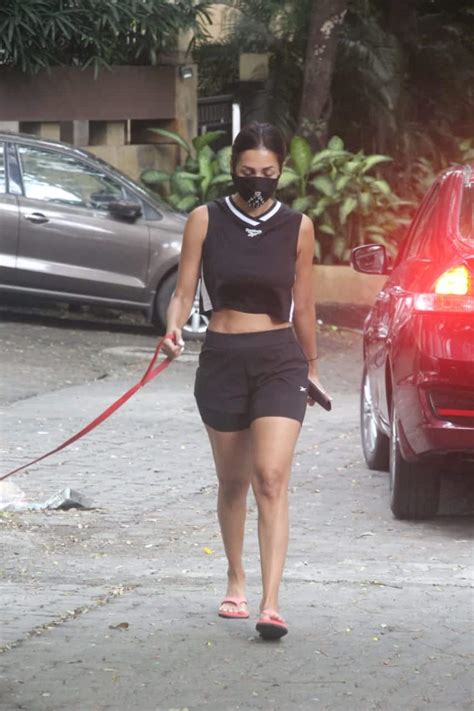 In pics: Malaika Arora takes her pooch on a stroll in black athleisure ...
