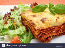 Beef Lasagne al Forno with salad   studio shot Stock Photo  