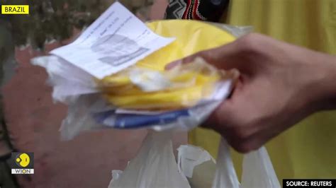 Catholic priest gives out masks in coronavirus-stricken Amazon favela ...