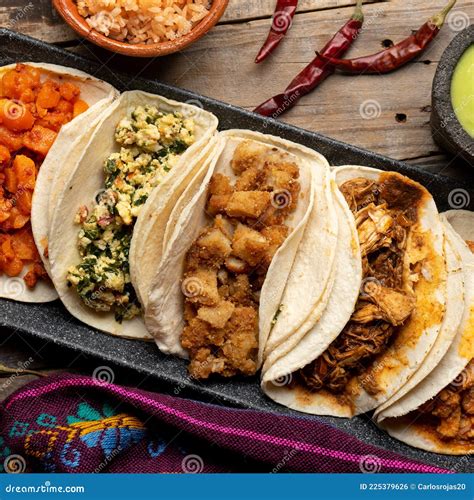 Different Types of Tacos Also Called Guisados on a Wooden Background ...