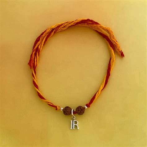 Choose Your English Alphabet Silver Charm Moli Rakhi Bracelet