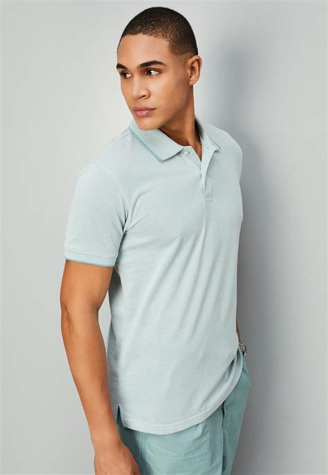 Buy Men Solid Slim Fit Polo T-shirt Online at just Rs. 599.0 ...