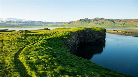 A lush scenic trail along a lagoon, Dyrhólaey, Iceland | Windows ...