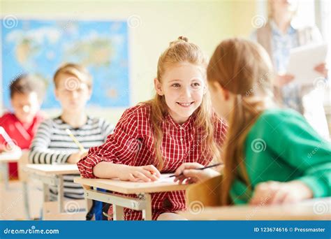 Positive Classmates Talking at Lesson Stock Photo - Image of people ...