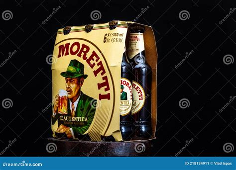 6 Pack of Birra Moretti Beer on Wooden Barrel with Dark Background ...