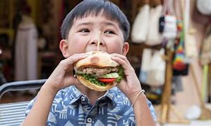 Image result for Kid Eating Burger