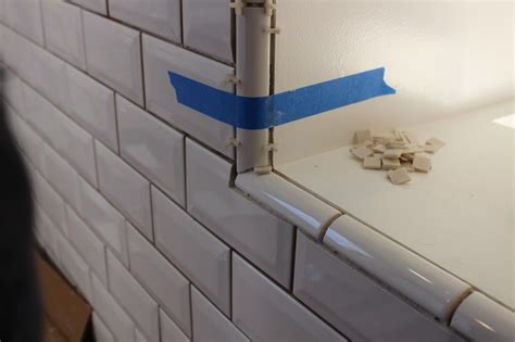 Tile Quarter Round on Bevel Cut for a Stylish Bathroom