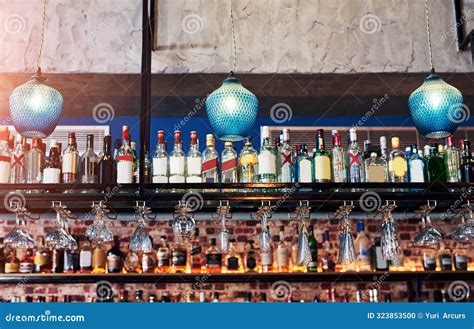 Pub, Alcohol Bottle and Upside Down Glasses in Restaurant for Cocktail ...