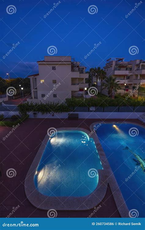 Illuminated Swimming Pools at Night Stock Photo - Image of leisure ...