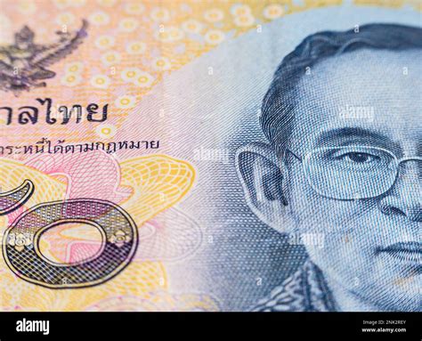 Macro detail with a 50 Thai Baht banknote. the baht is the official currency of Thailand Stock ... - currency of thailand