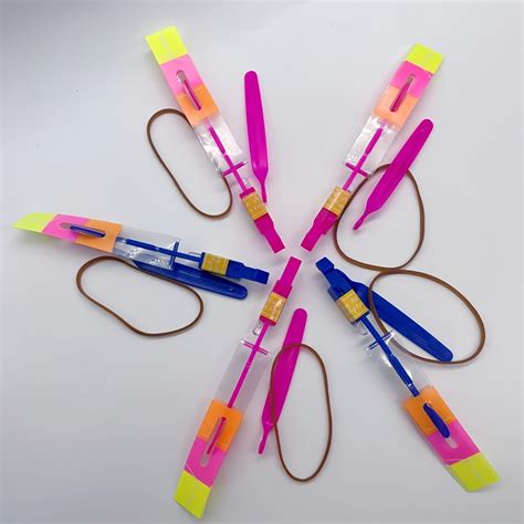 5pcs LED Flying Arrows Rocket Helicopters Party Fun Slingshot Flying ...