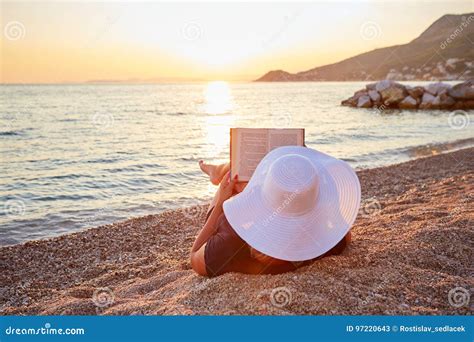 Woman Reading a Book on the Beach Stock Image - Image of sunset, ocean ...
