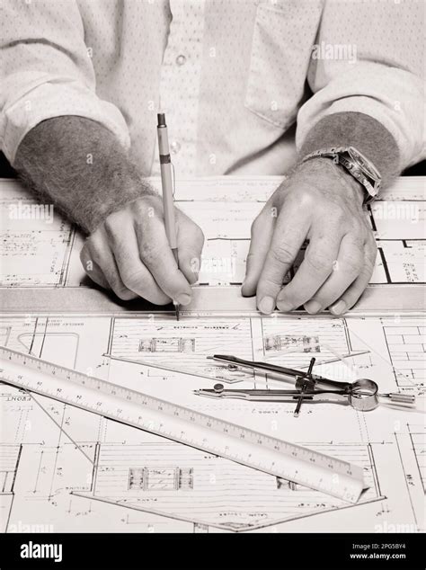 1970s HANDS ONLY OF A DRAFTSMAN WORKING ON HOUSE ELEVATION WITH MECHANICAL PENCIL SCALE RULER ...