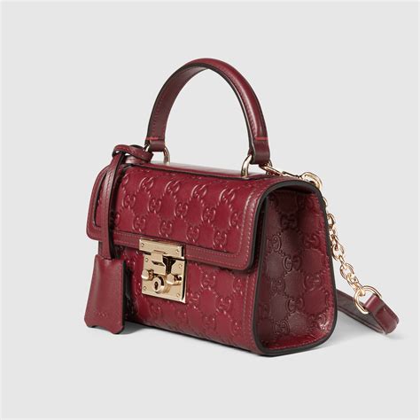 Padlock small top handle bag in Rosso Ancora red GG leather | GUCCI® NL