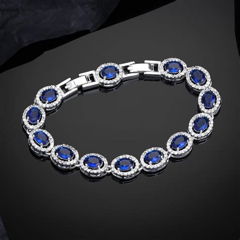Estele Rhodium Plated Dazzling Blue American Diamonds Enhanced Charm B