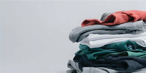 Premium Photo | The Impact of Fast Fashion A Pile of Clothes ...