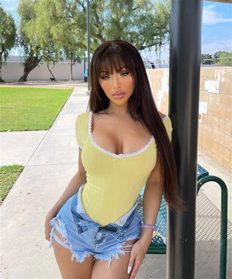 Elena Genevinne – Most Beautiful Trans Women Outfits in Bodysuit with Denim Shorts - TG Beauty