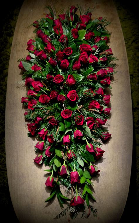 Gorgeous red rose funeral casket spray | Casket flowers, Funeral ...