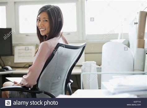 Businesswoman Sitting in Office Stock 的图像结果
