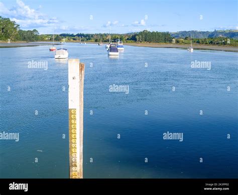 Sea tide depth measure in bay at Omokoroa, Tauranga New Zealand Stock Photo - Alamy