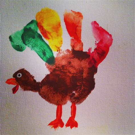 Hand print turjey made with finger paint | Thanksgiving crafts preschool, Handprint crafts ...