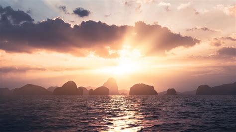 Wallpaper sea, rays, sun, rocks, sunset hd, picture, image