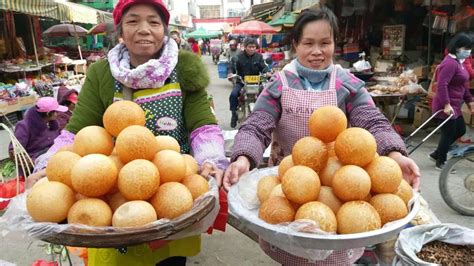 化州满街传统小吃：油鼓籺、油角、粽子、酸菜……