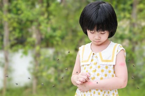 Little girl has skin rash allergy itching and scratching on her arm ...