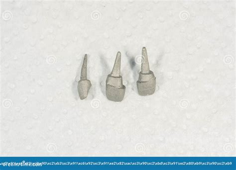 Ceramic Tooth Crowns and Metal Pins Close-up Macro. Orthopedic Dentistry Restoration of Decayed ...