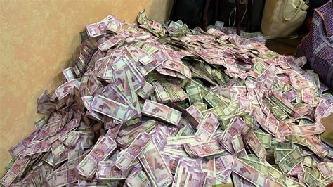 Rs 20 crore seized after ED raids on Bengal minister's aide, BJP says ...