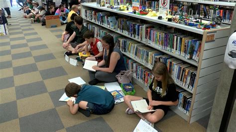 LGBTQ+ community holds ‘read-in’ at Blasco Library over pride display ...