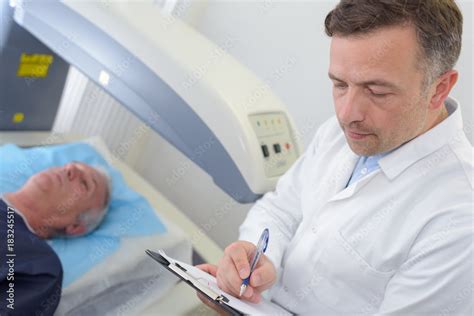 Image of a doctor and a patient reviewing a scan.