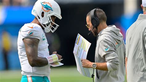 Dolphins coach Darrell Bevell coached while lying face down after eye surgery