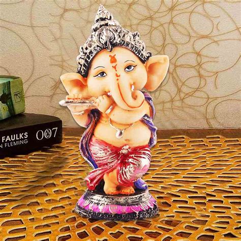 Shop Beige Ganesha Statue Playing Flute – Ideal Ganesh vigraha for Garden