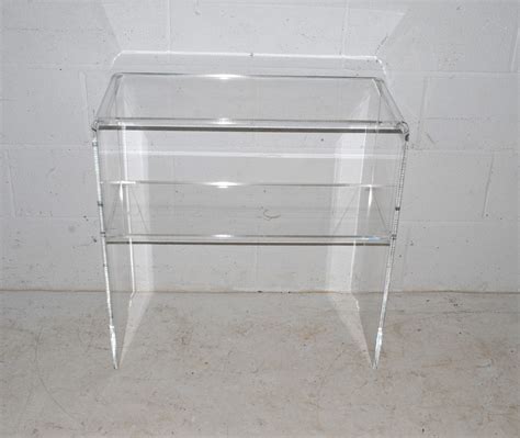 A clear Perspex two tier freestanding shelf - length 70cm, depth 30cm ...