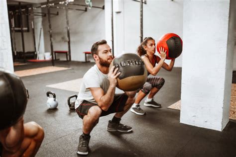 Image result for Squats Using Exercise Ball