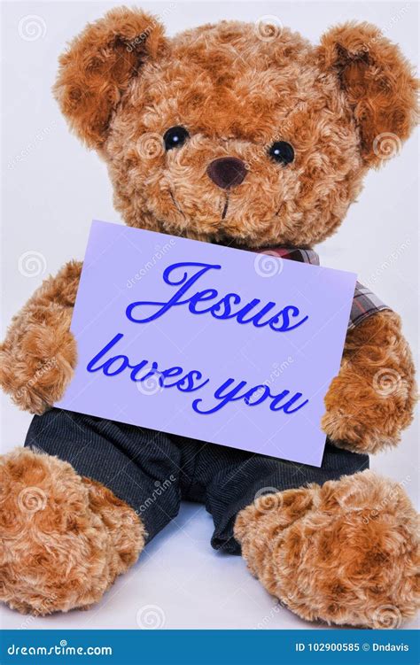 Teddy Bear Holding a Purple Sign that Says Jesus Loves You Stock Image ...