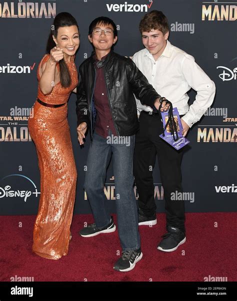 (L-R) Ming-Na Wen, Son Cooper Dominic Zee and Guest at the Disney+'s ...