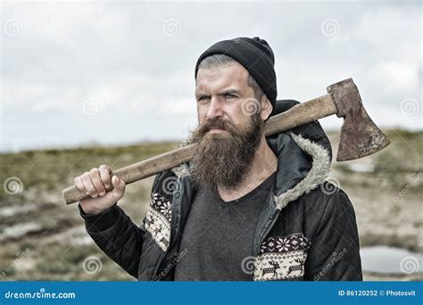 Bearded Handsome Serious Man with Rusty Axe on Mountain Top Stock Photo ...