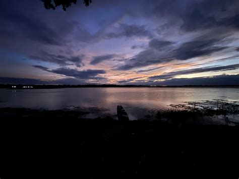Over a lake in NE Thailand : r/sunset