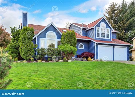 Large Blue House with White Trim and a Nice Lawn. Stock Photo - Image ...