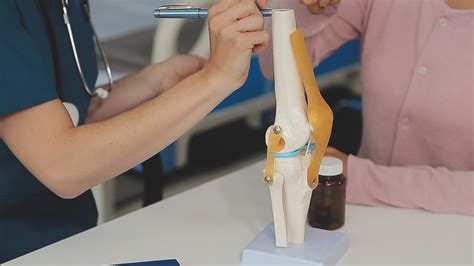 Human cruciate ligament injury treatment concept. Orthopedist showing ...