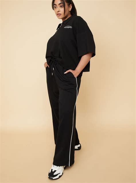 Buy Women Side Striped Wide-Leg Track Pants Online at just Rs. 899.0 ...