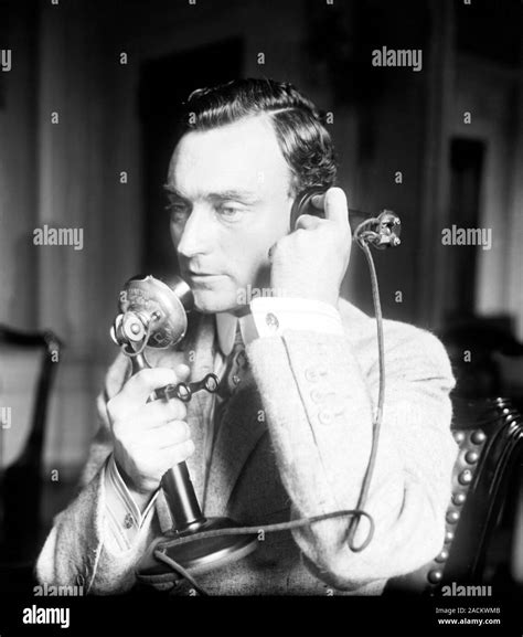 John Purroy Mitchel (1879-1918), mayor of New York, using a telephone ...
