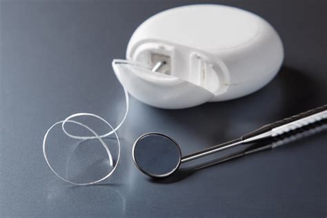 The correct technique for flossing teeth - Best Dentist in Warsaw | Warsaw Dental Center
