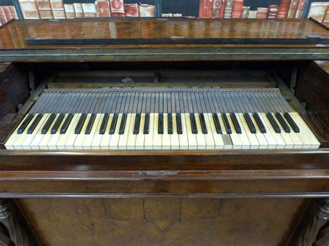 A c19th walnut cased reed organ/harmonium with foot pedal operated ...