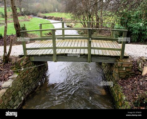 Small wooden bridge over river, Cornwall, UK Stock Photo - Alamy